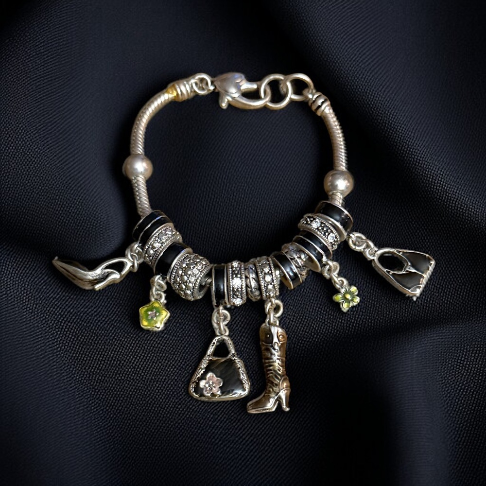 Silver tone sliding beads and charms bracelet